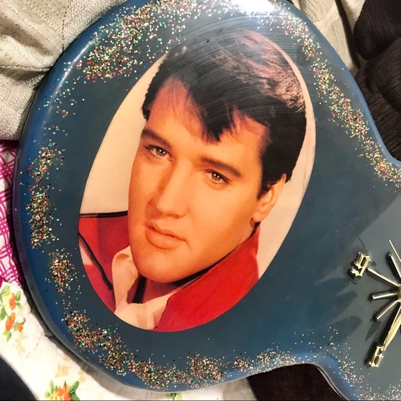 Elvis clock blue with glitter under coating. Works.